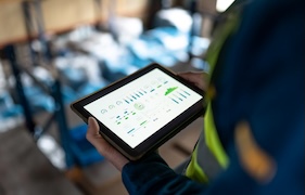 A person looking at their tablet 