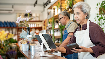 A woman on a tablet in a store