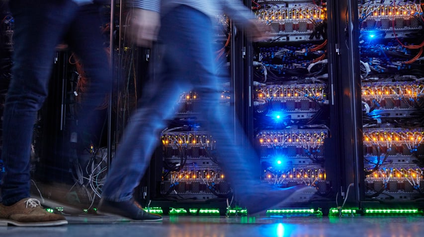 person walking in server room