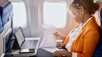 woman using wifi on plane