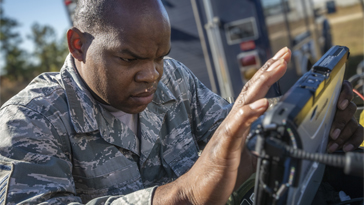 image of soldier using connected device