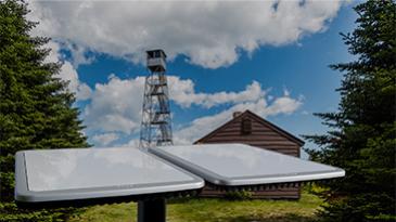 antenna in front of cabin and tower