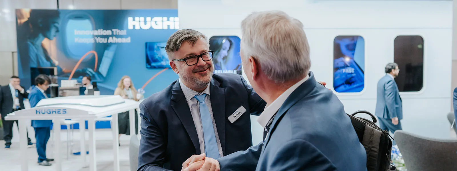 Two people shaking hands at AIX