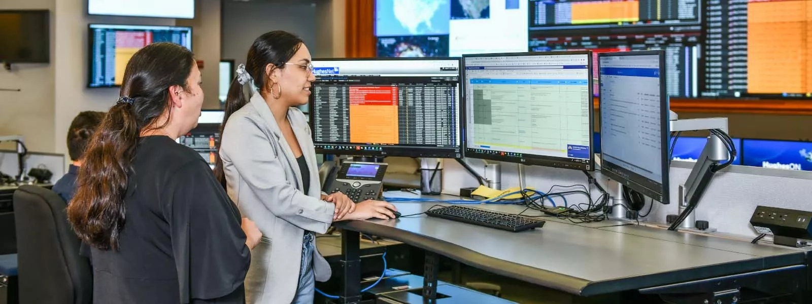 Hughes employees collaborating 