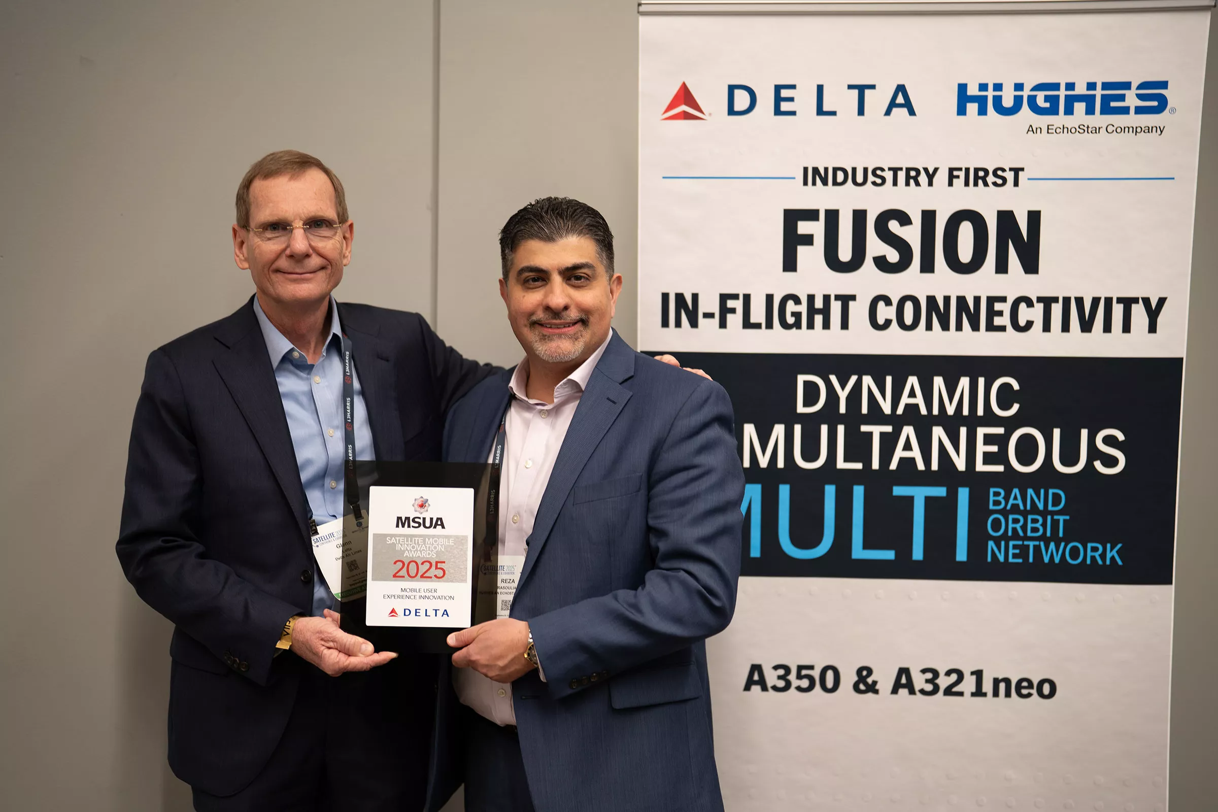 Hughes and Delta employees posing for picture