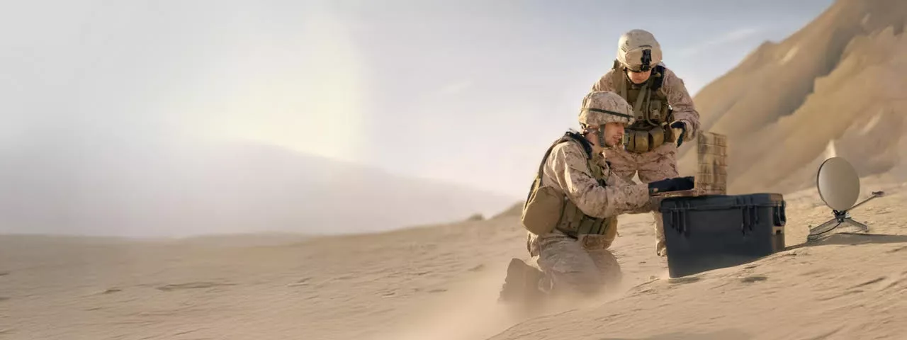 two soldiers using remote connectivity for communications