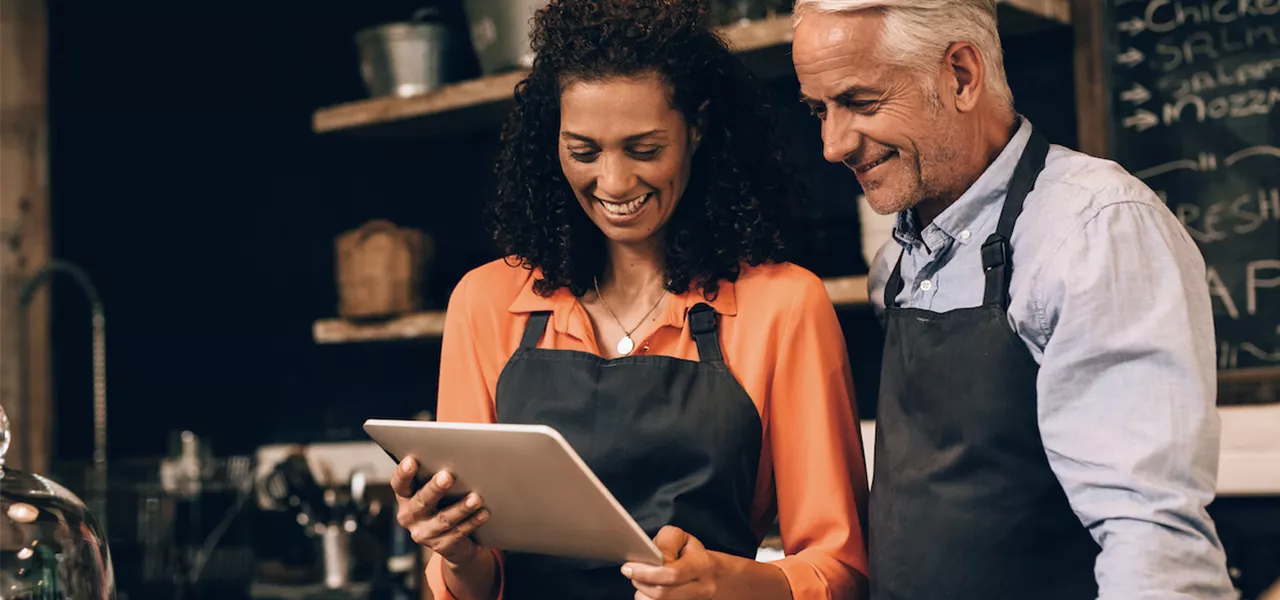 colleagues working with managed wireless in a business
