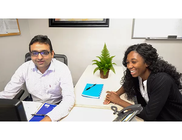 Hughes mentor and mentee collaborating 