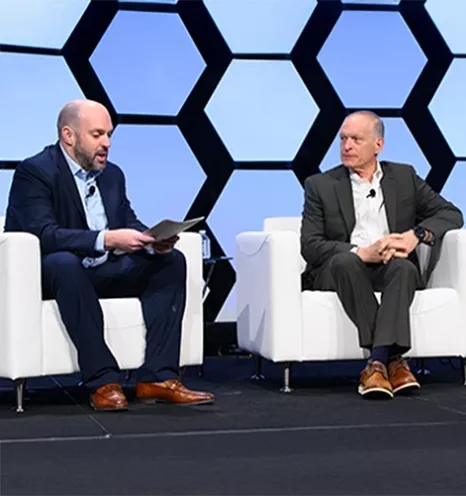 Hughes employees in session at SatShow