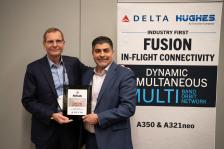 Hughes and Delta employees posing for picture