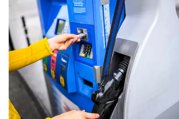 entering a card into gas pump