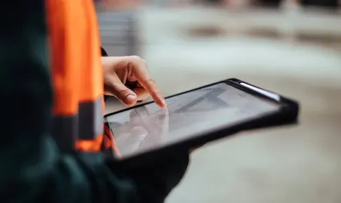 A close up of a person using a tablet