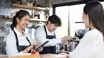 barista with tablet
