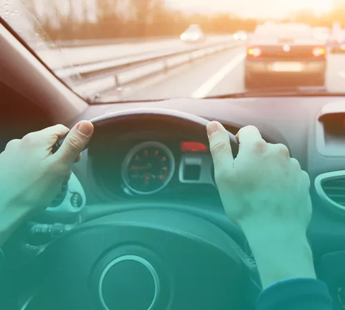 hands on a steering wheel