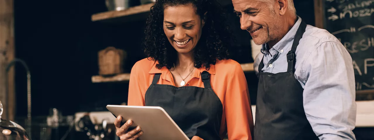 colleagues working with managed wireless in a business