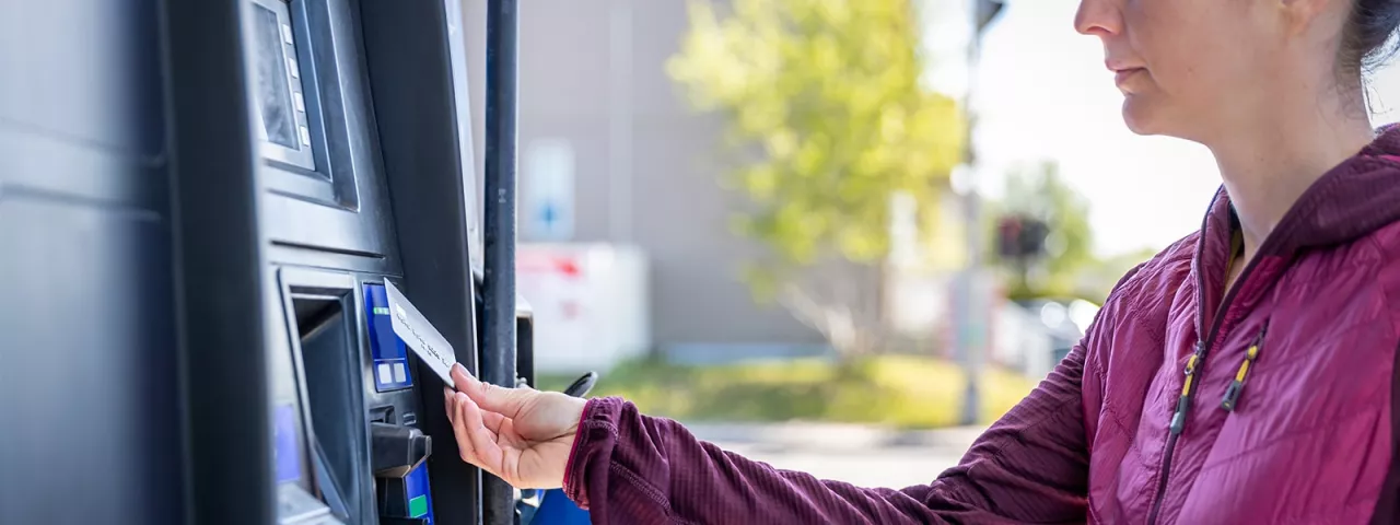 woman at gas pump