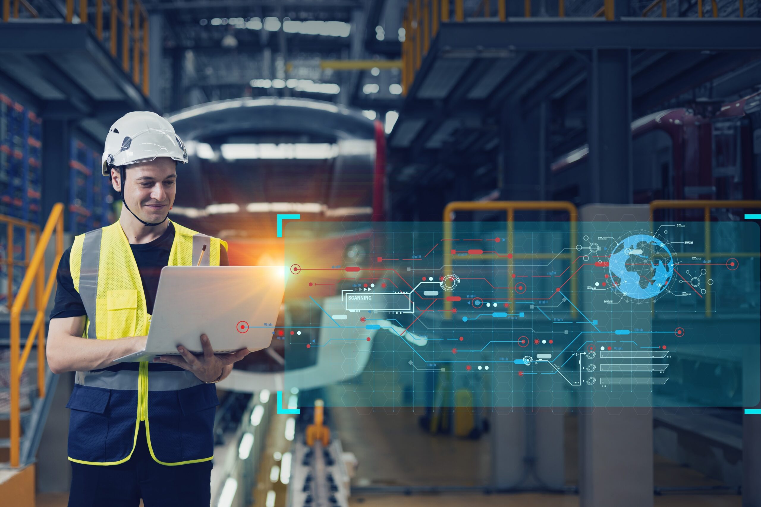 A person wearing a vest and hard hat looking at a laptop