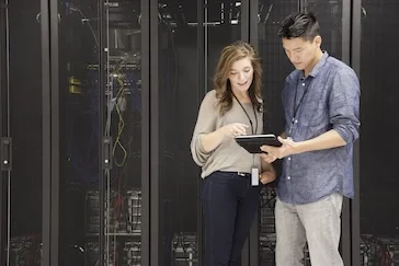 A woman and man looking at a tablet together