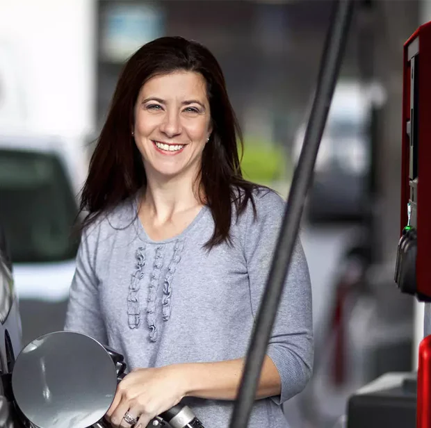 woman pumping gas